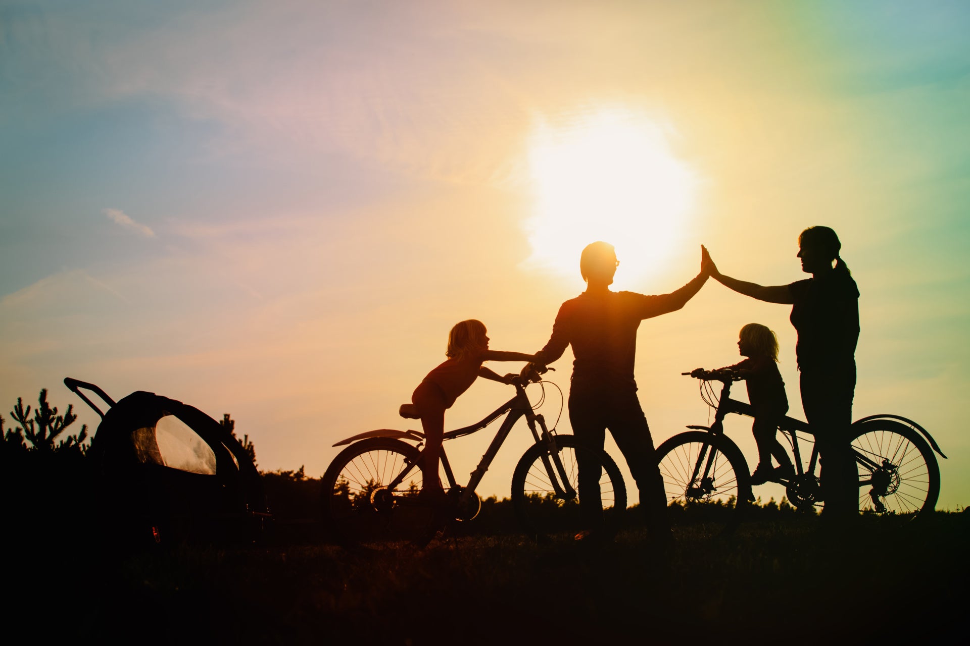 biking family high fiveing