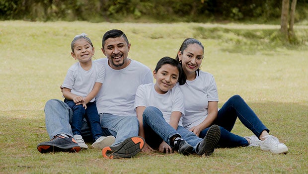 family sitting together smiling