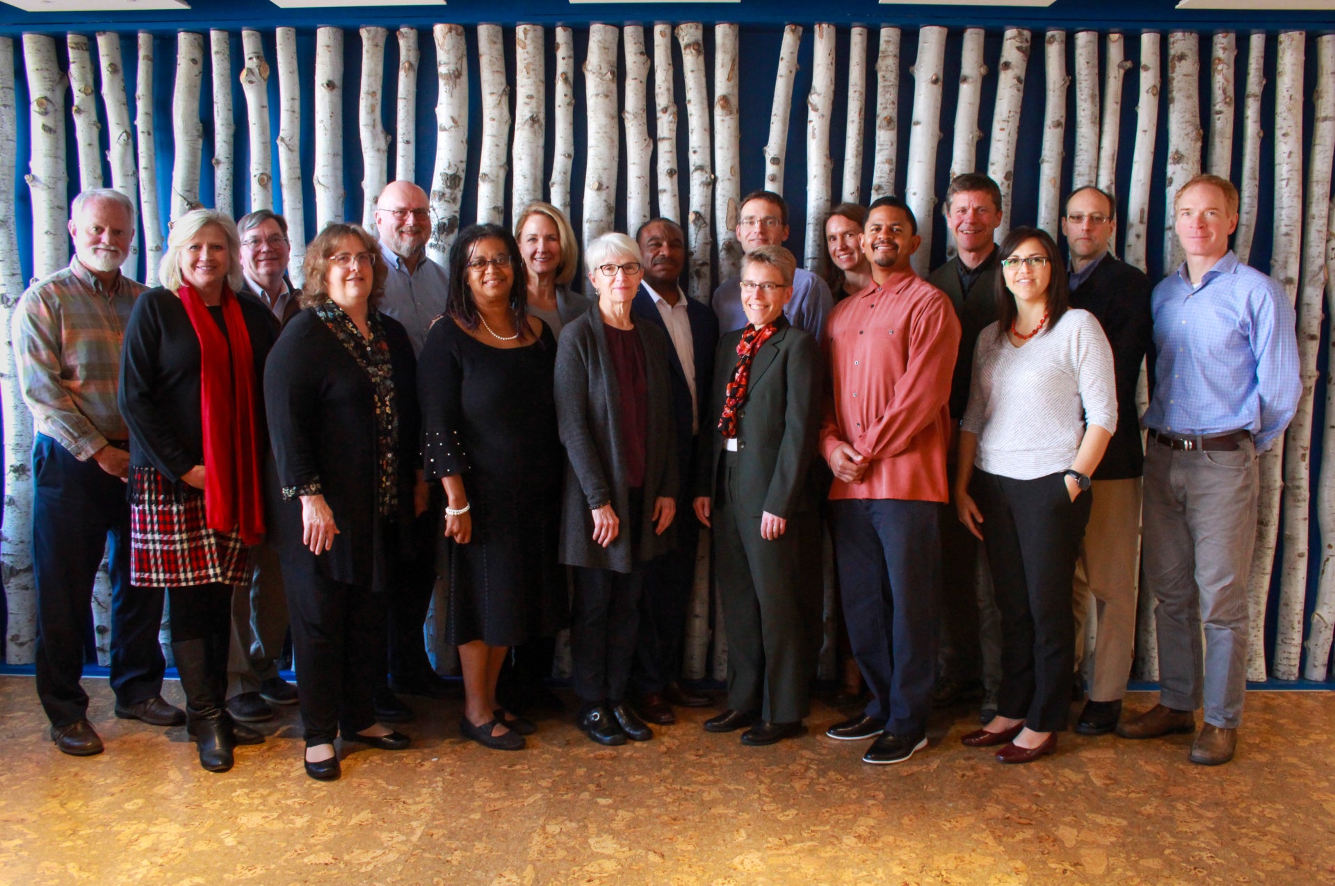 Coworkers standing together smiling