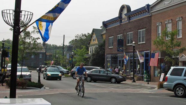 Biker biking through small town