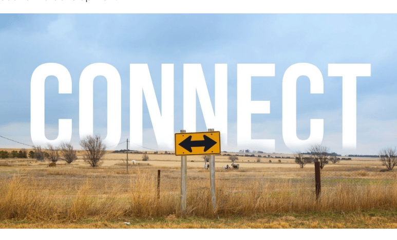 Rural road with double-pointing arrow street sign with text "Connect" in the sky