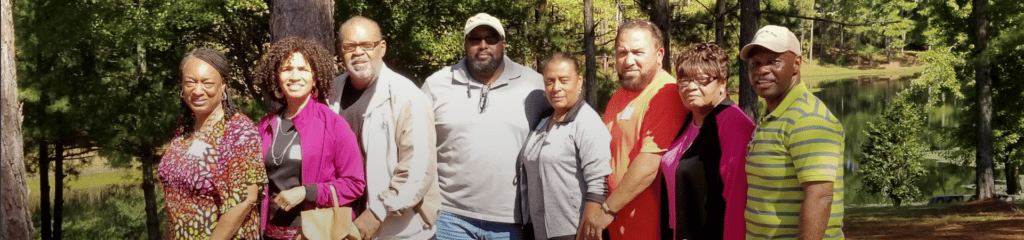 Group of Black practitioners smiling at camera