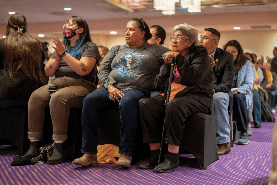 Community members sitting in audience