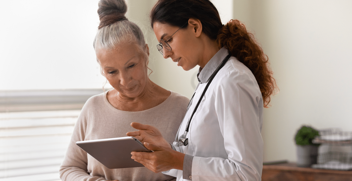 Medical practitioner walking patient through information