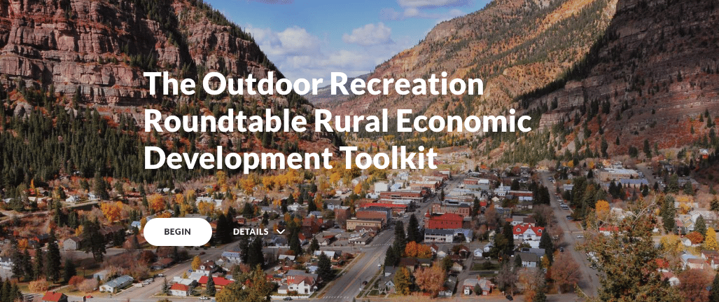 The Outdoor Recreation Roundtable Rural Economic Development Toolkit heading over aerial view of mountain valley town