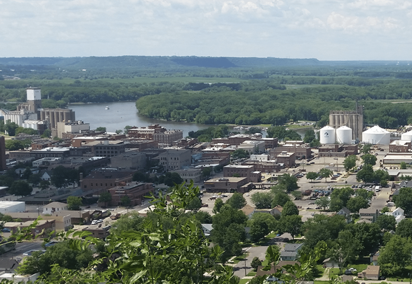 Aerial view of town next to forested area