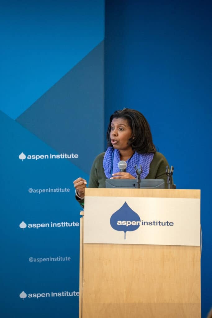 Bonita Robertson-Hardy, Aspen CSG staff member, speaks at a podium