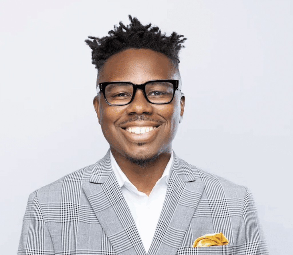 Tim Lampkin smiling on white background