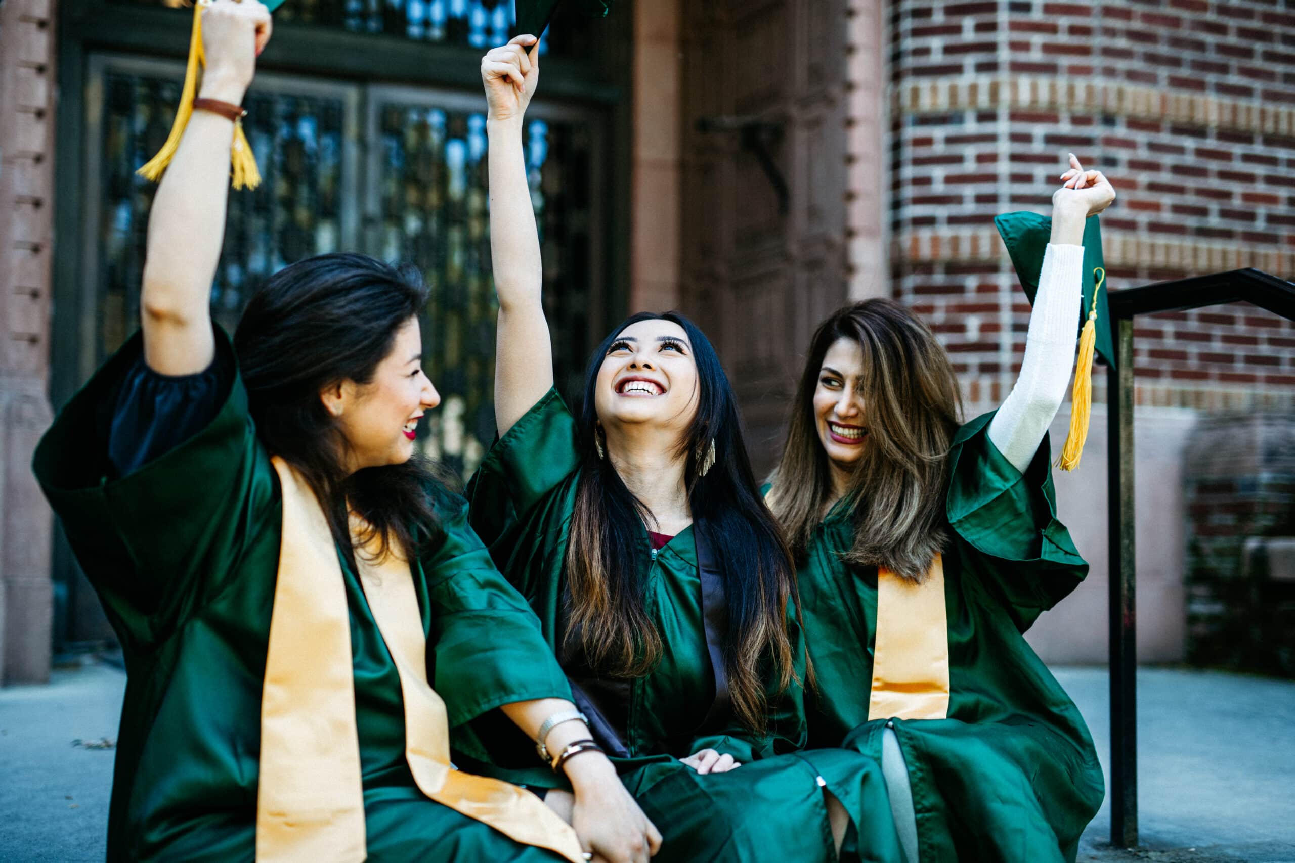 Graduates celebrating, representing programs that help young people stay connected to their rural communities